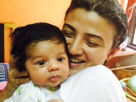 Suhasi goradia dhami with her newborn baby