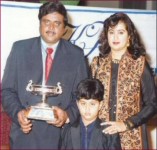 Sumalatha ambarish old family picture: ambarish receiving a prize with his wife and son abhishek