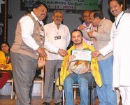 Sunil rao receiving an award