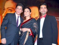 Karan johar with shahrukh khan and kajol at a film promotional event.