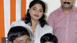 Minmini with her family: husband and children